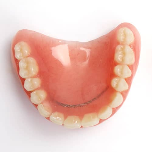 Upper denture on white background
